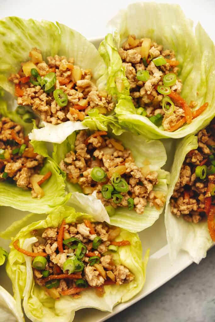 ground pork lettuce wraps on a white platter
