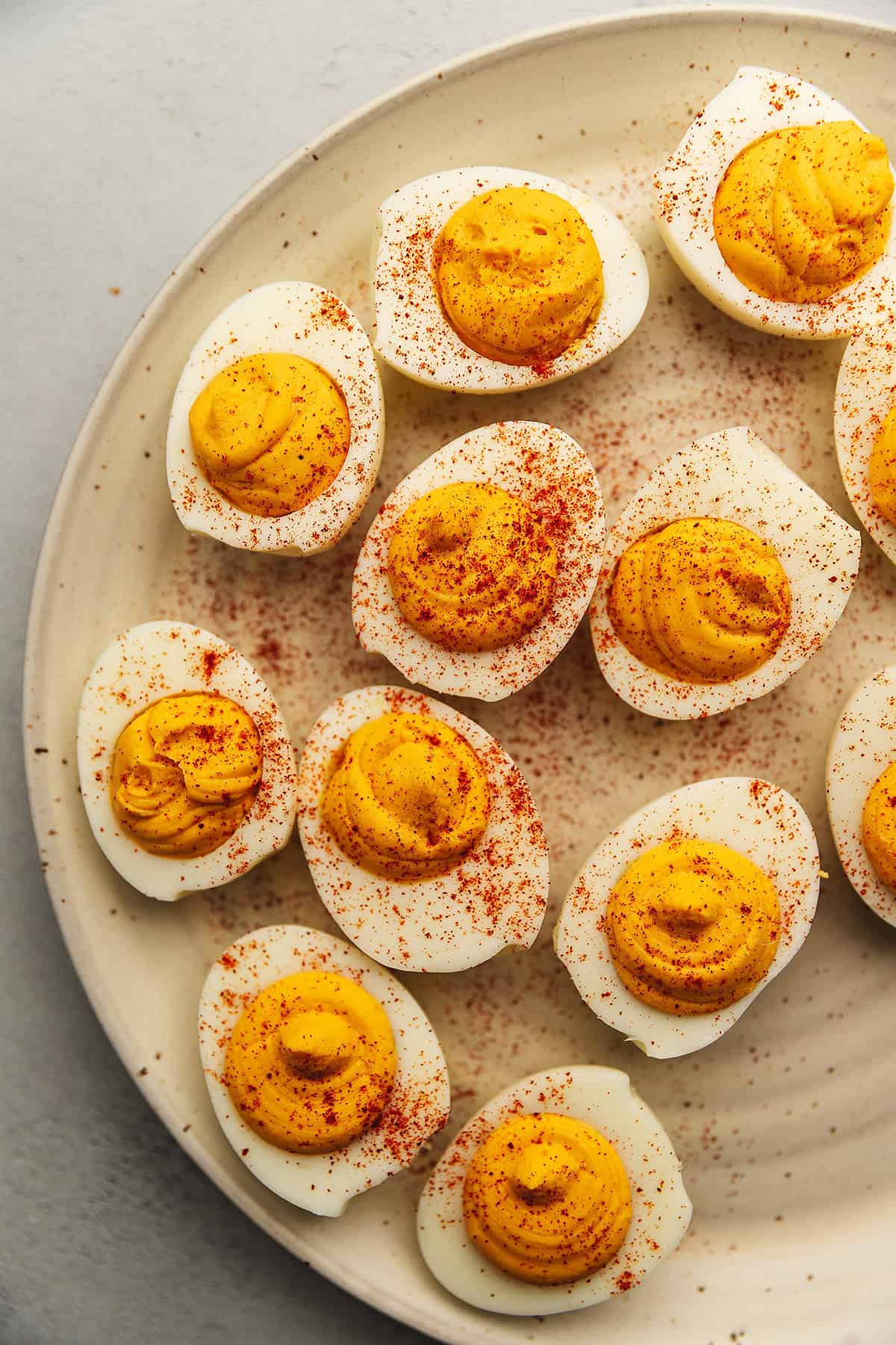 spicy deviled eggs on a plate