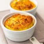 Creamy cheesy baked keto eggs in ramekins for low carb breakfast or snack. Perfect for keto, Atkins, and low carb diets.