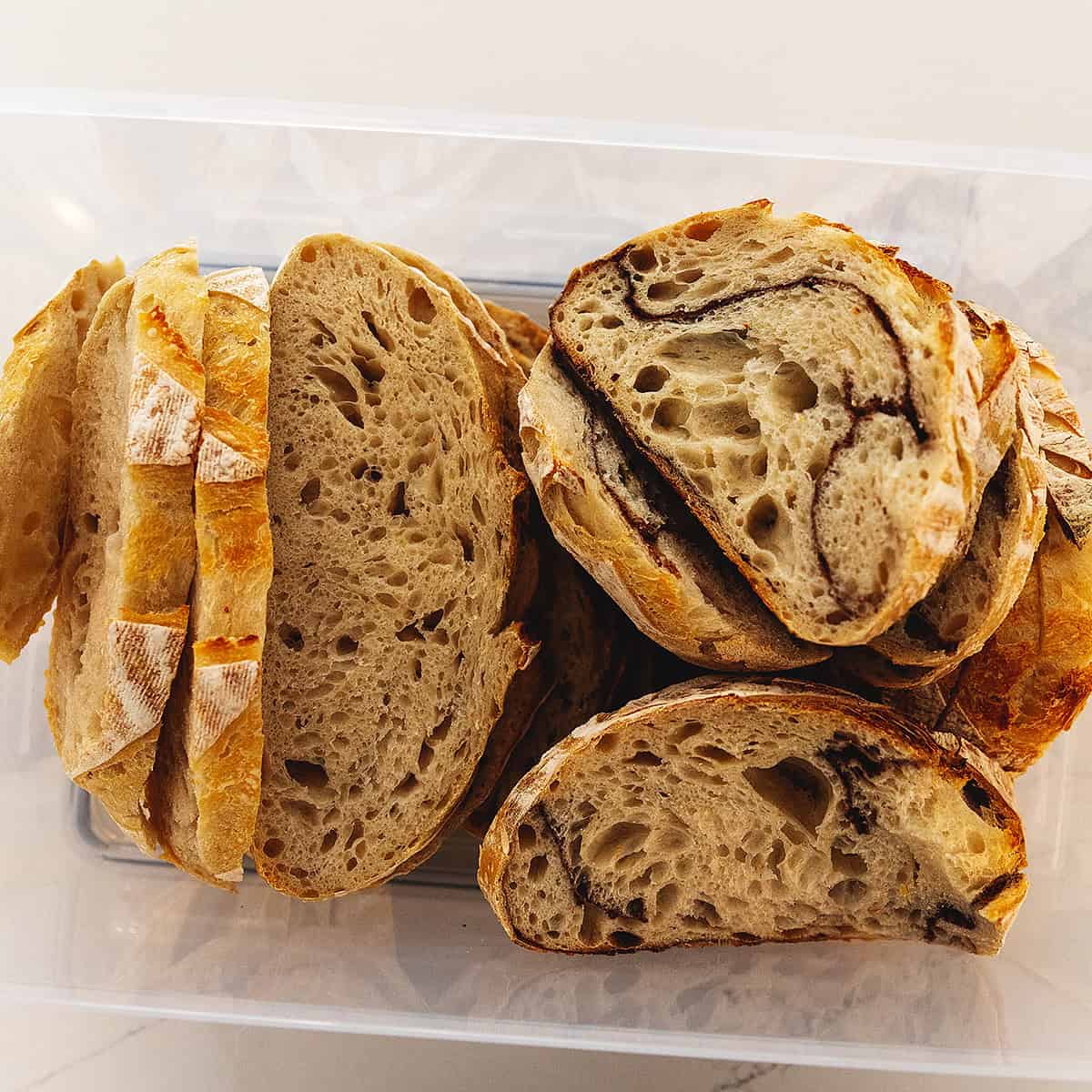 sliced sourdough bread in a bread box