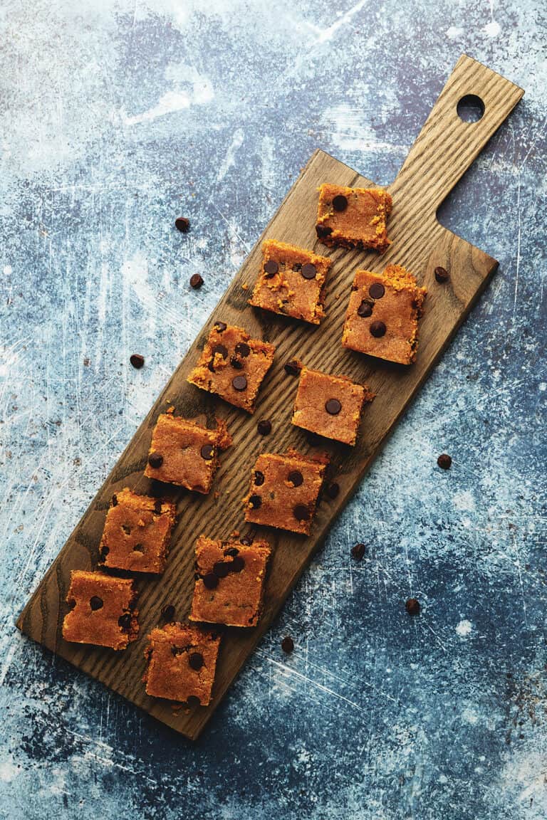 protein bites on a wood serving board