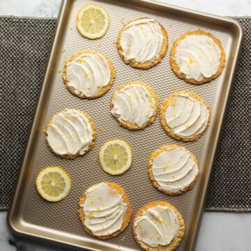 iced lemon cookies on a sheet tray