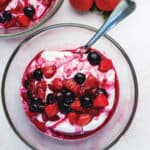 a bowl full of yogurt and berries