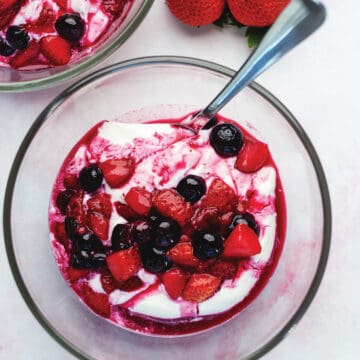 a bowl full of yogurt and berries