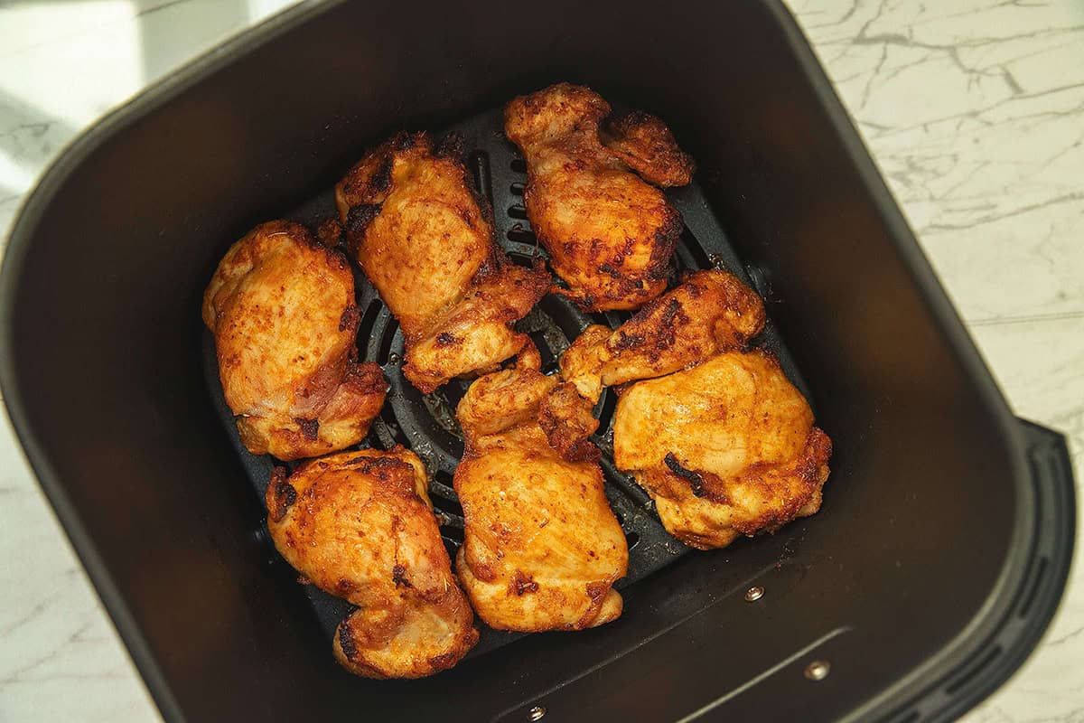 air fryer boneless skinless chicken thighs in the basket