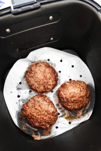 3 burgers cooked in an air fryer
