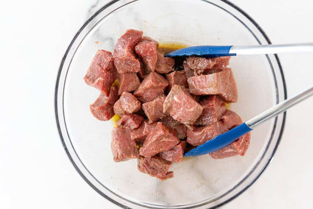 seasoned steak for steak bites in a bowl