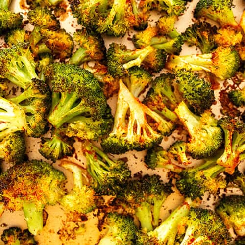 crispy roasted broccoli on a sheet tray