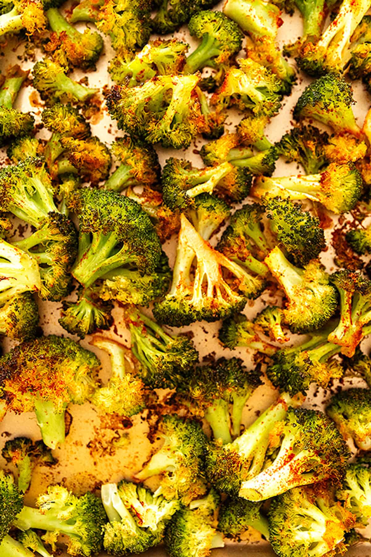 crispy roasted broccoli on a sheet tray