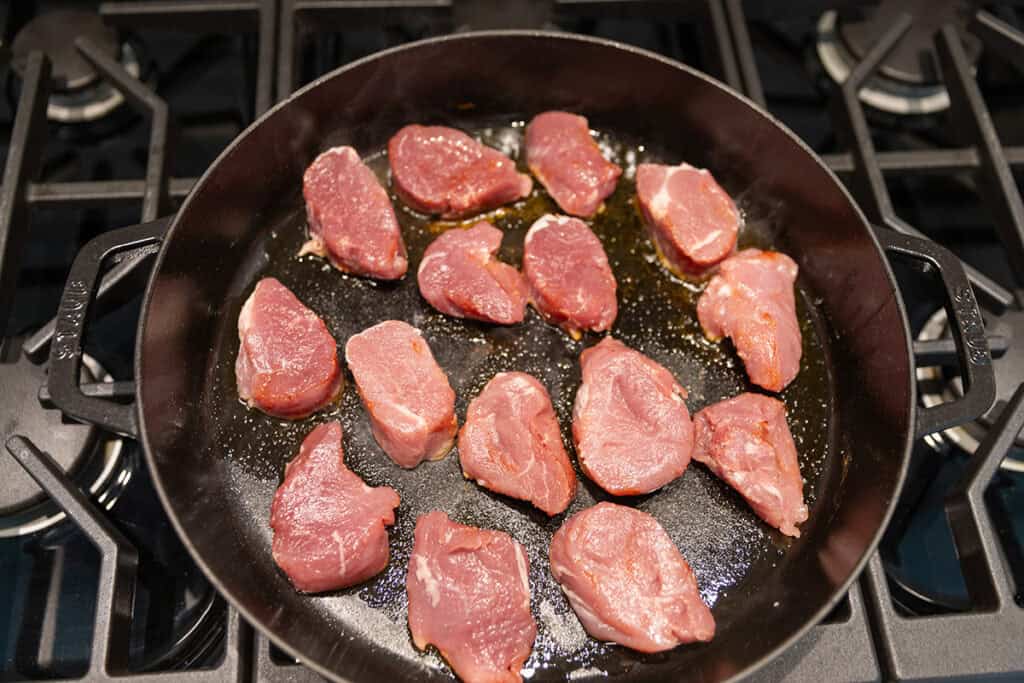 pork tenderloin searing in a pan