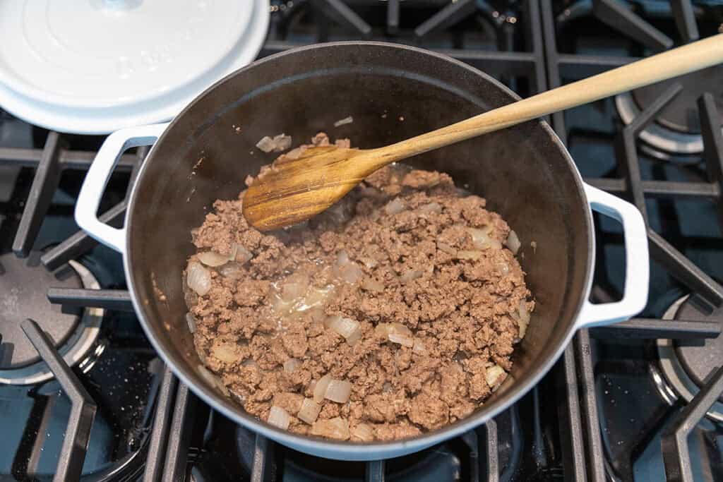 cooking ground beef and onions for high protein lasagna soup