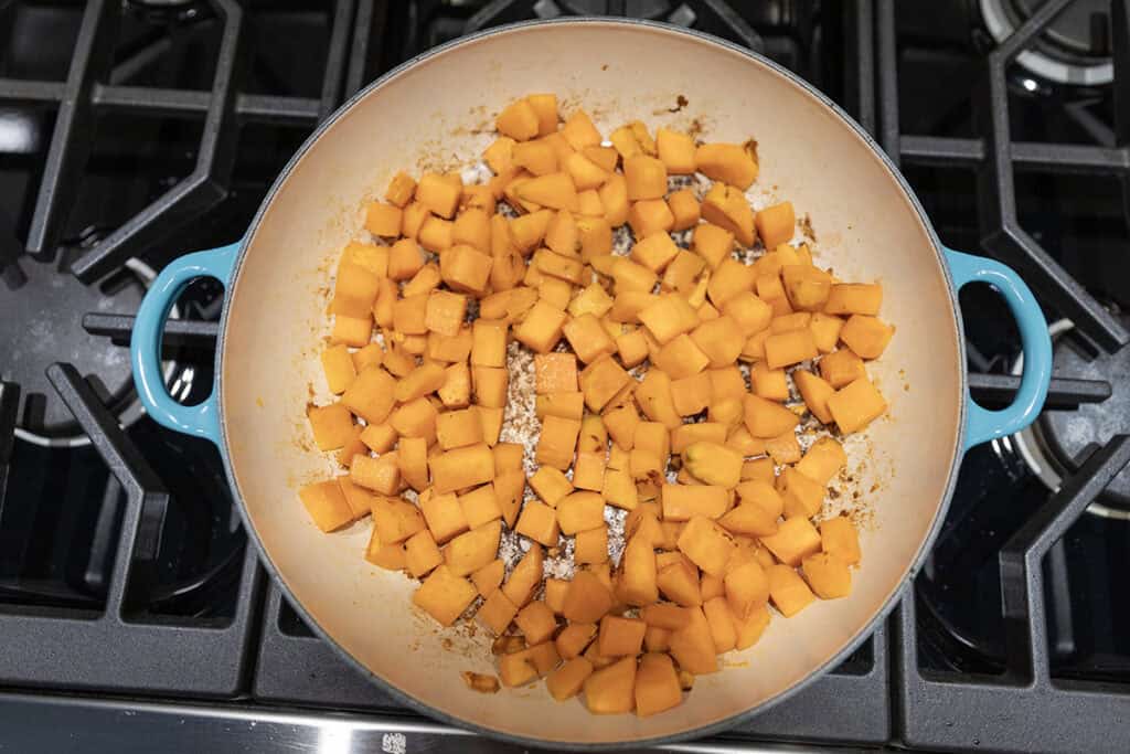 sweet potatoes cooking in a skillet